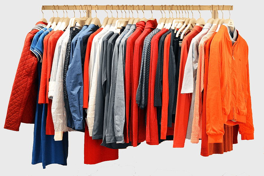 assorted-color clothes rack, T-shirt closet organization, boutique clothing display, dry cleaning wardrobe, fashion retail hangers, outerwear storage solutions, capsule wardrobe arrangement
