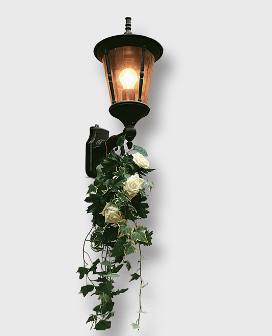 black sconce with green leaves, traditional street light fixture, lantern with floral decoration, vintage lighting effect, outdoor wall-mounted lamp, decorative street illumination, classic outdoor lighting design black sconce with green leaves, traditional street light fixture, lantern with floral decoration, vintage lighting effect, outdoor wall-mounted lamp, decorative street illumination, classic outdoor lighting design