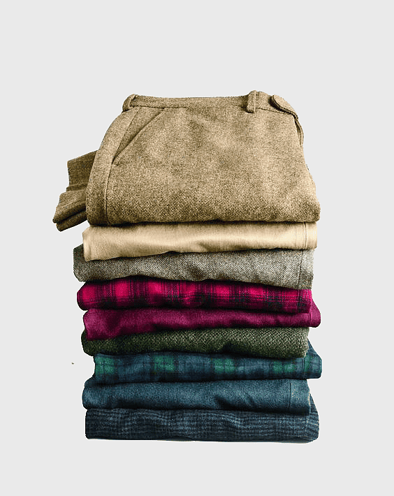 stacked bottoms, assorted-color trousers, casual clothing stack, textile products, folded garments, layered apparel, plaid fabric collection stacked bottoms, assorted-color trousers, casual clothing stack, textile products, folded garments, layered apparel, plaid fabric collection