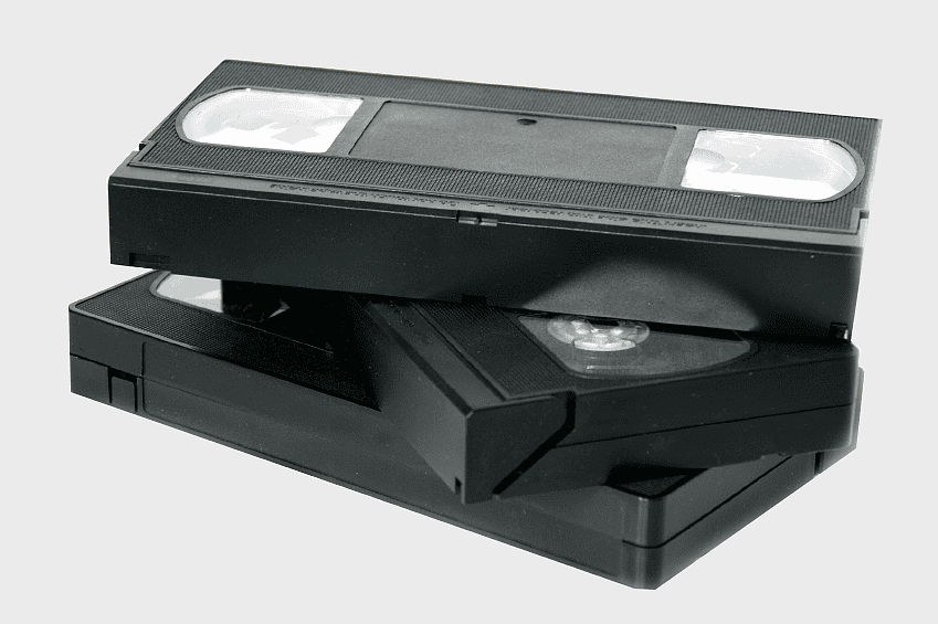 VHS cassette tape, compact cassette videotape, VHS Compact Cassette Media, magnetic tape for VHS, retro video technology, vintage recording media, analog video formats VHS cassette tape, compact cassette videotape, VHS Compact Cassette Media, magnetic tape for VHS, retro video technology, vintage recording media, analog video formats