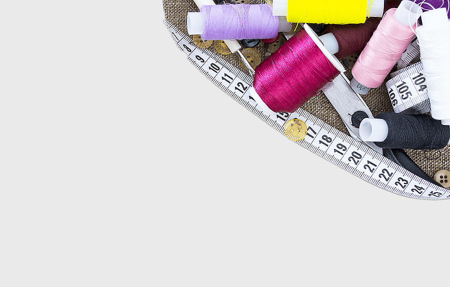 sewing thread spools, tailor scissors, needlework tools, assorted-color threads, fabric crafting supplies, textile crafting materials, sewing kit essentials